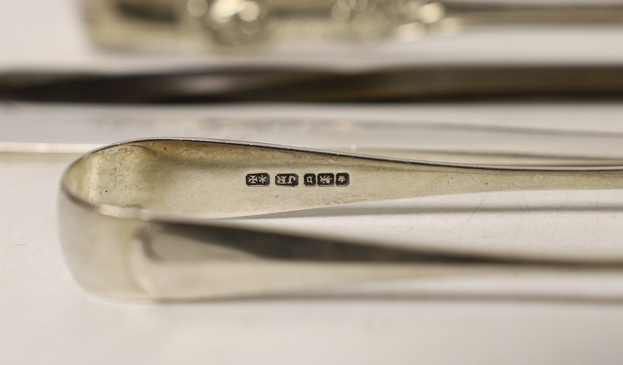Two pairs of silver sugar tongs, including Victorian King's pattern a white metal toddy ladle and a modern silver letter opener.